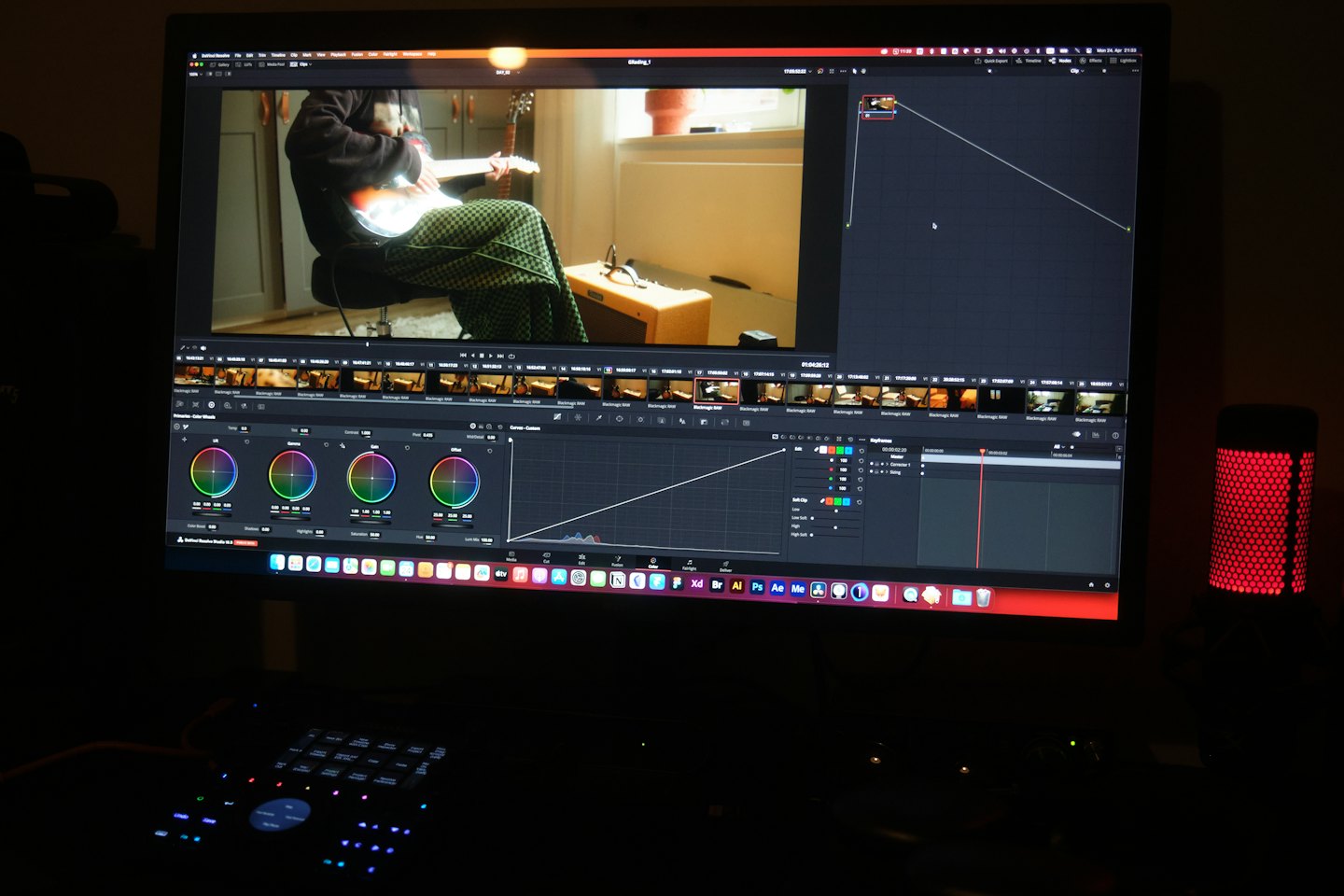 Computer screen shows video editing software with color grading tools.